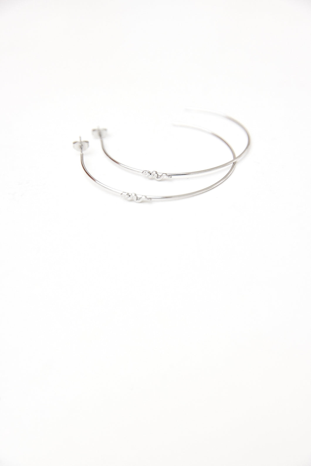 Large fine hoops with a small snake