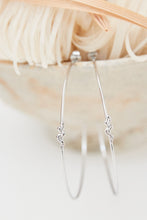 Large fine hoops with a small snake