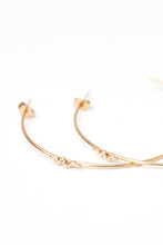 Large fine hoops with a small snake