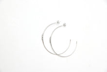 Large fine hoops with a small snake