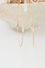 Large fine hoops with a small snake