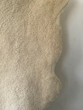 Fluffy offwhite sheep skin