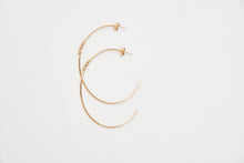 Large fine hoops with a small snake