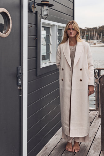 Cream double breasted trench coat