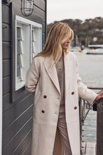 Cream double breasted trench coat