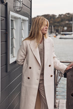 Cream double breasted trench coat