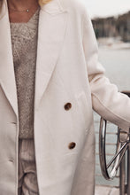 Cream double breasted trench coat
