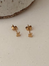 X stud earrings