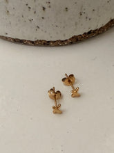 X stud earrings