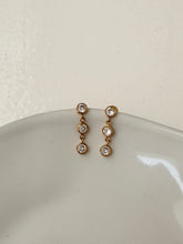 Triple diamond dangly studs