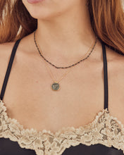 Fine necklace with stone medallion