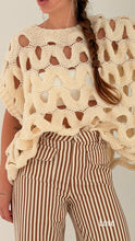 Loose sleeveless knit