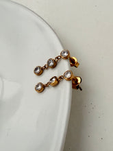 Triple diamond dangly studs