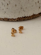 X stud earrings