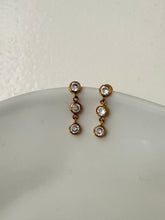 Triple diamond dangly studs