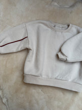 Oversized sweater with red arm detail