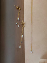 Clear gem necklace and hanging earrings