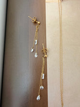 Clear gem necklace and hanging earrings