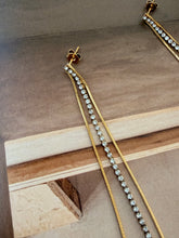 Long chain and diamonty earrings