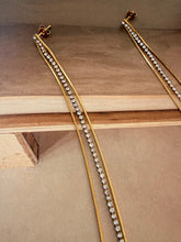 Long chain and diamonty earrings
