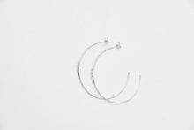 Large fine hoops with a small snake