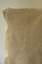 Fluffy offwhite sheep skin