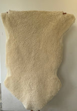 Fluffy offwhite sheep skin