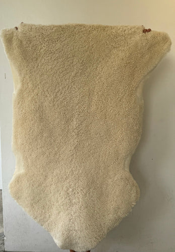 Fluffy offwhite sheep skin