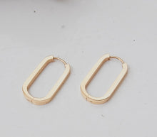 oval long thick gold earrings