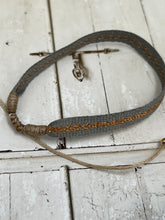 Grey and copper string bracelet