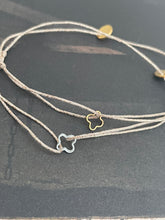 Cross shape bracelet on lurex string