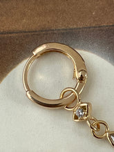 Hoop earrings with eye and stone plated gold