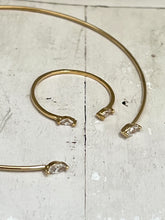 Thin bangle with joining diamond shaped stones