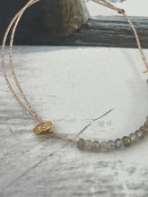 Grey beads bracelet on lurex string