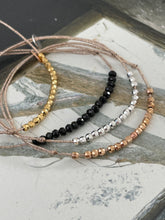 Beads bracelet on lurex string