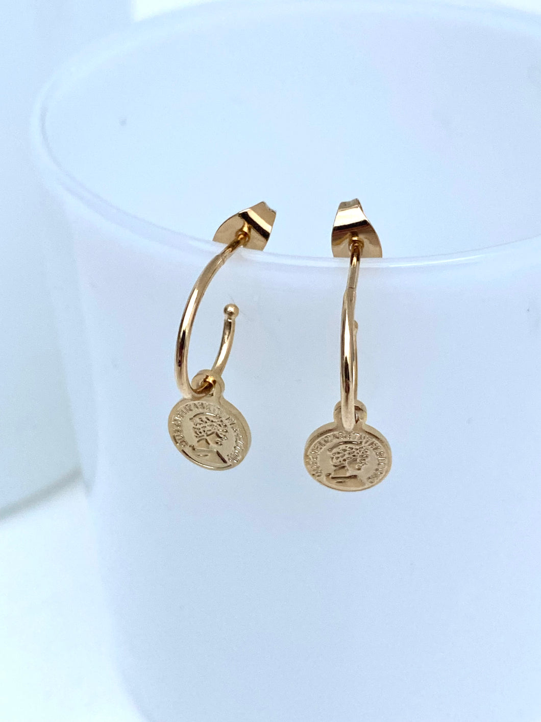 open hoop earrings plated gold with medallions