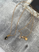 Gold chain necklace with black diamond