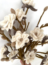 magnolia branch with off white flower