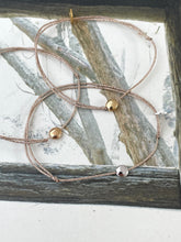 Stud bracelet on lurex string