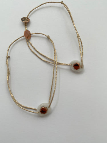 Oval rock treffle bracelet on lurex string