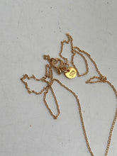 stone cross on gold plated chain