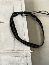 Black and gold string bracelet