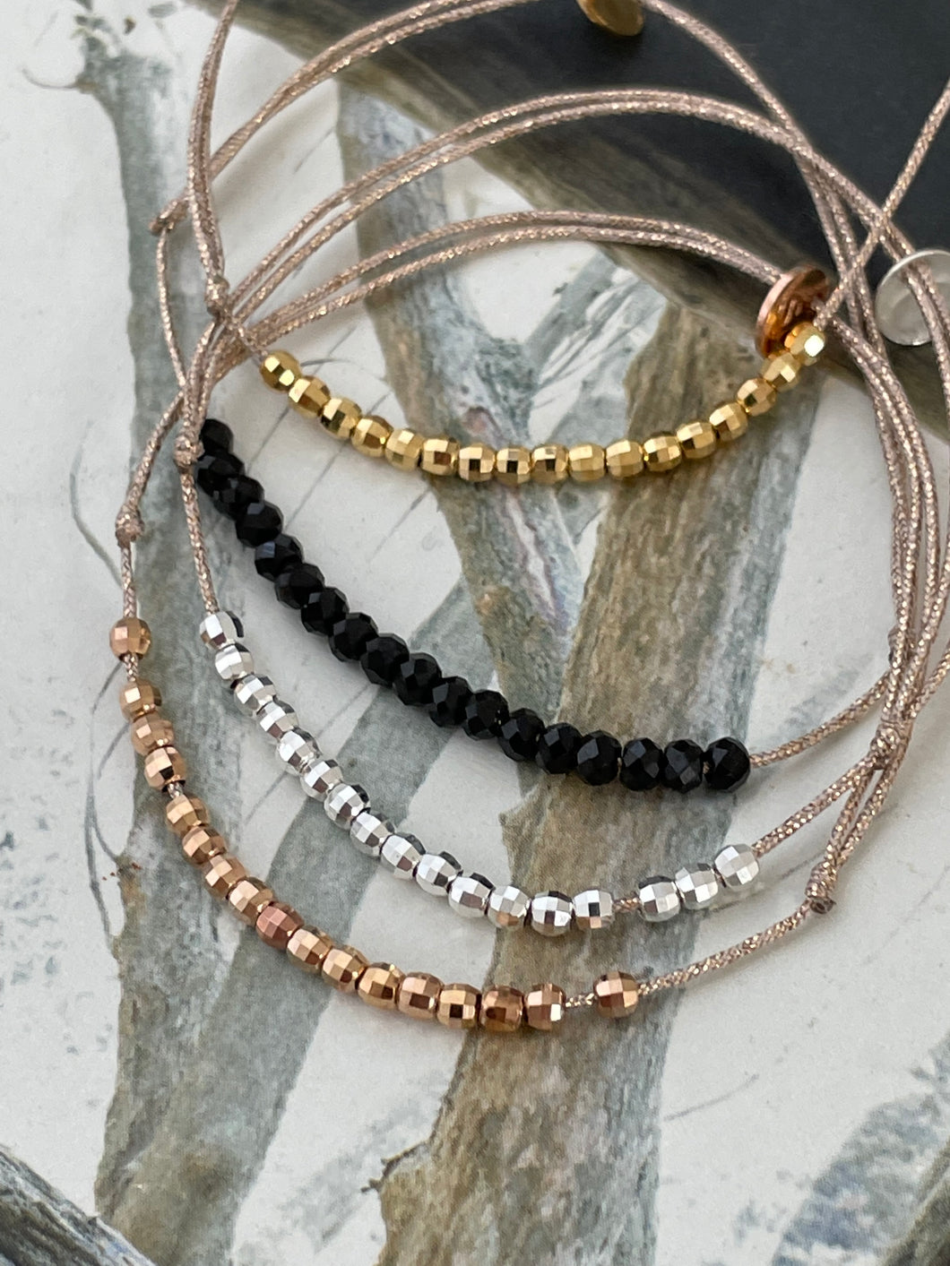 Beads bracelet on lurex string